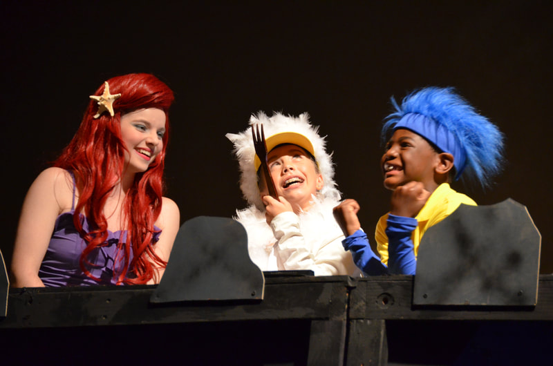 Ariel, Scuttle, and Flounder in "The Little Mermaid", admiring a fork.