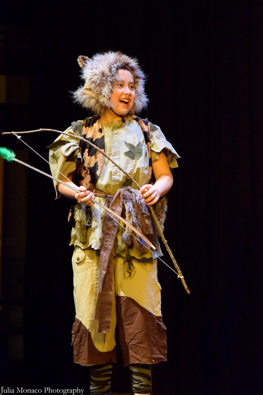 A child holding a bow and arrow, from the music 