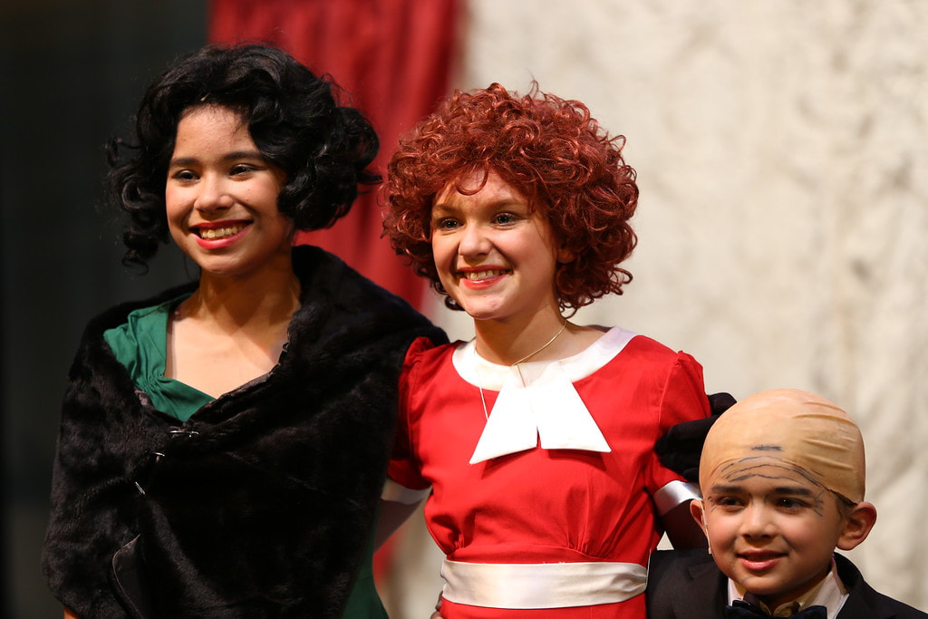 Grace Farrell, Annie, and Mr. Warbucks, from the musical "Annie Jr".